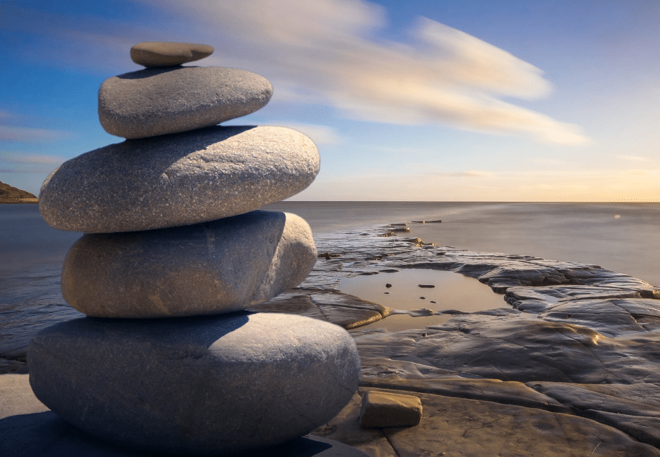 Rocks stacked on the beach to represent integral breath therapy